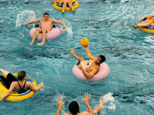 BYU undergraduate Marcelo Gomez of Mikasa eyes up the goal before taking a shot against The Blue Team during a coed innertube water polo in the Richards Building on the campus of BYU, Thursday, Jan. 21, 2010. PATRICK SMITH/Daily Herald